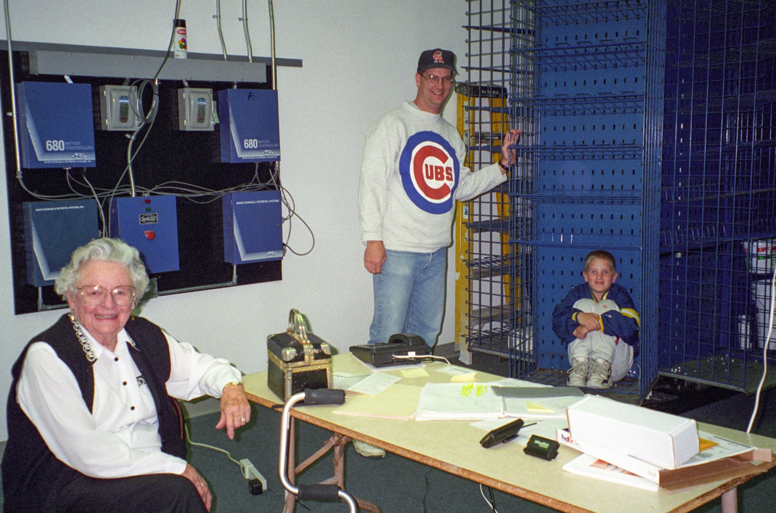 A young Chris Jones sitting inside a vertical storage carousel at the family 3PL